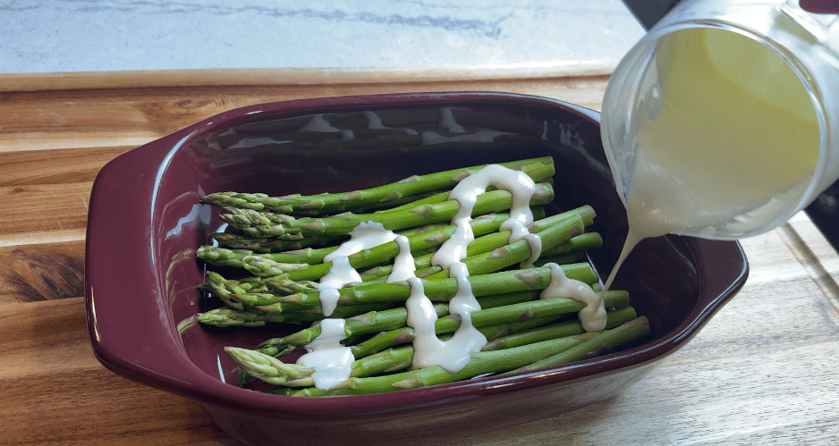 The cream sauce formula poured over freshly steamed asparagus