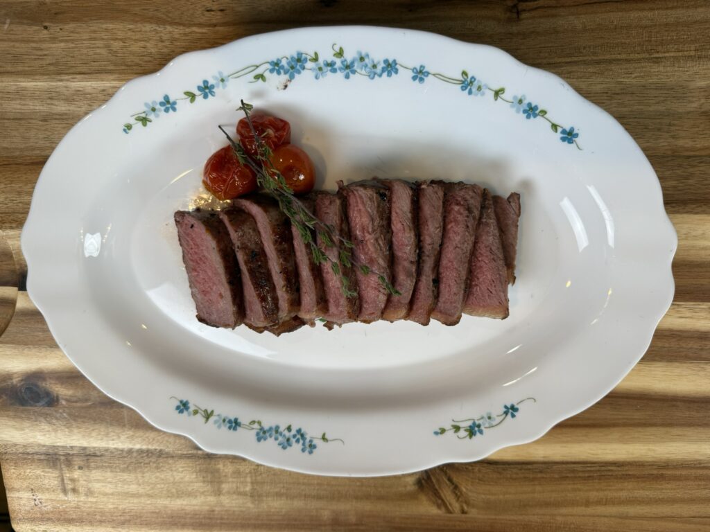 Sliced steak with garnish