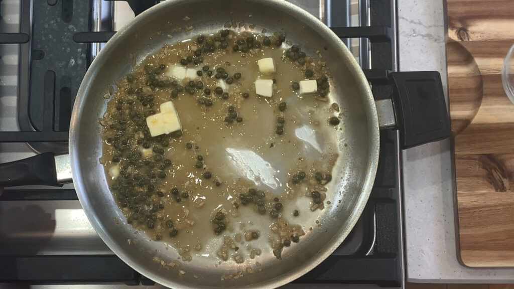 Swirling cold butter into the pan sauce for a glossy finish