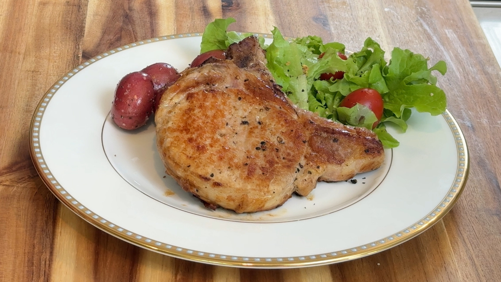 Pan seared pork chops plated