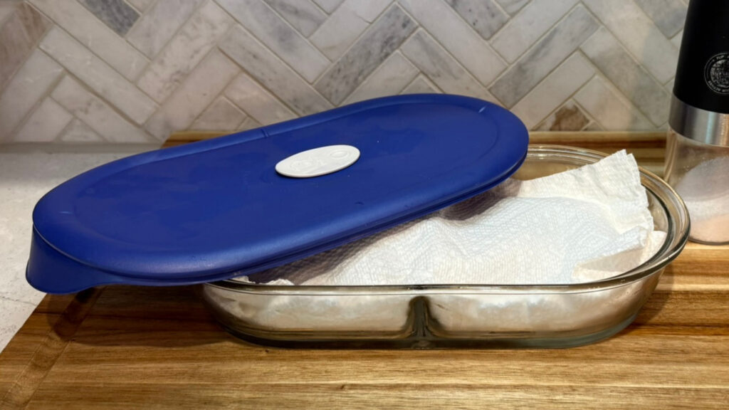 Scallops ready to thaw overnight in the refrigerator, wrapped in paper towels"