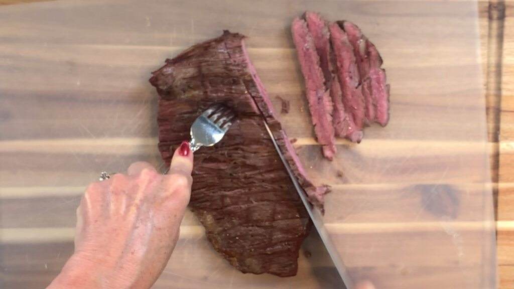Slicing flank steak against the grain