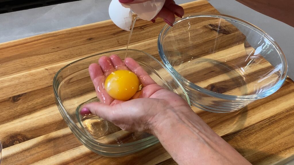 Cracking an egg, separating the yolk from the white