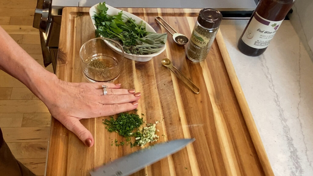 Herbs being chopped to add to fresh homemade mayonnaise. 