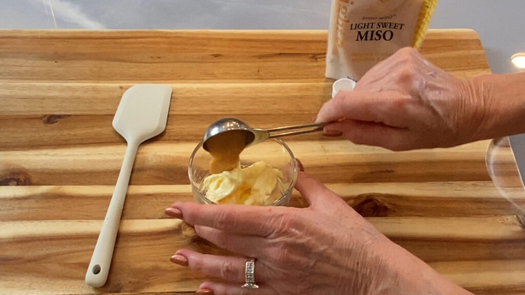 White Miso being added to a dish of fresh homemade mayonnaise. 