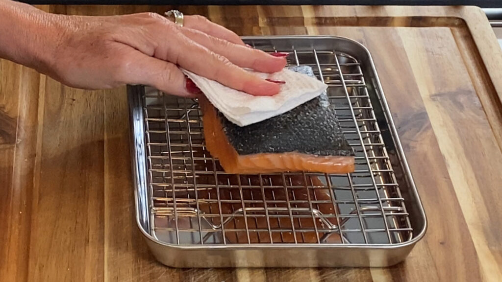 Salmon being patted dry.